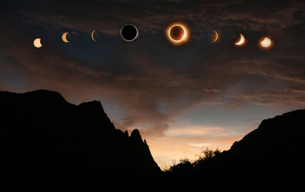 Sequence of solar eclipse phases captured over the dramatic silhouette of Lerdo, Mexico at sunset.